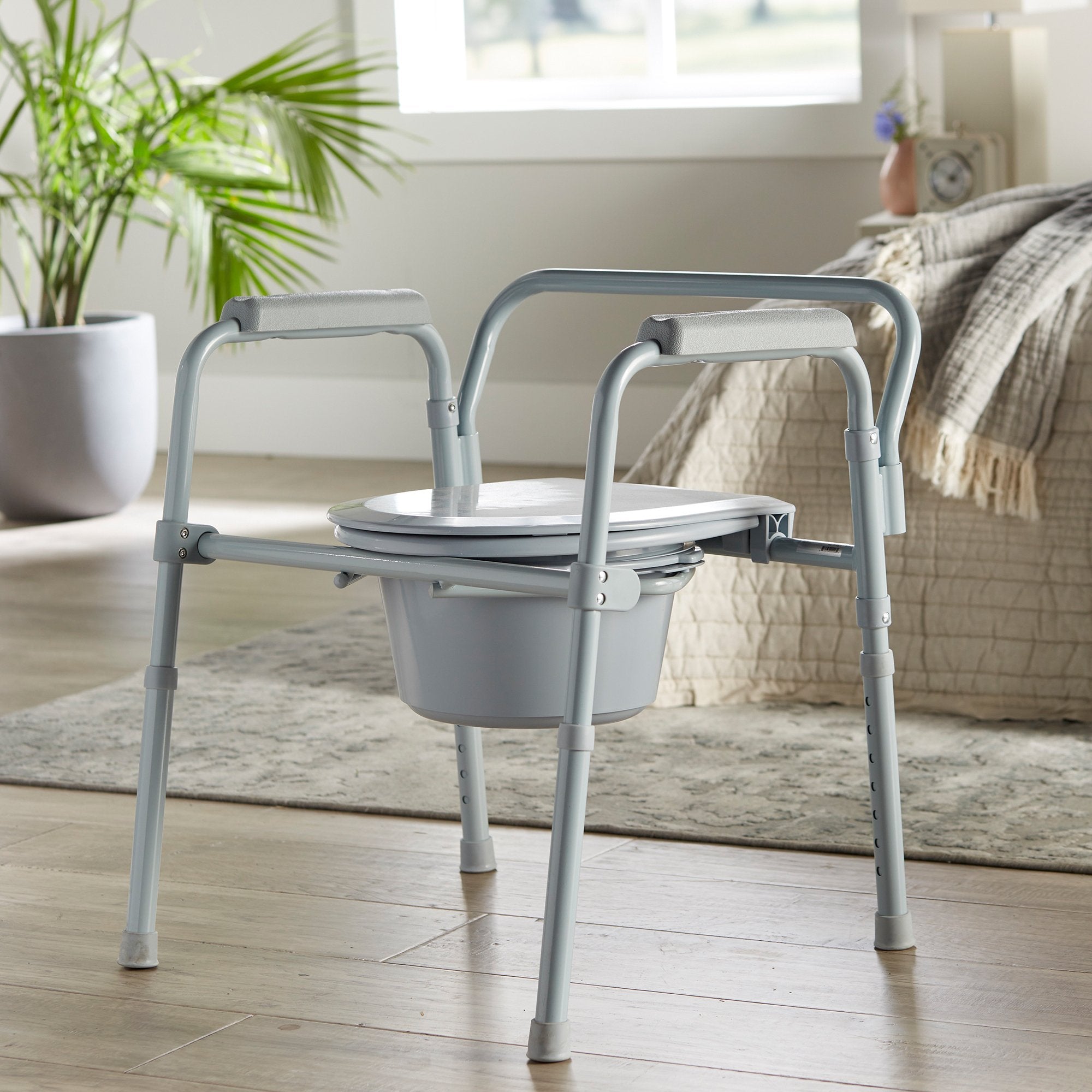 McKesson Steel Folding Commode Chair - Adjustable, Portable, 350lb Capacity